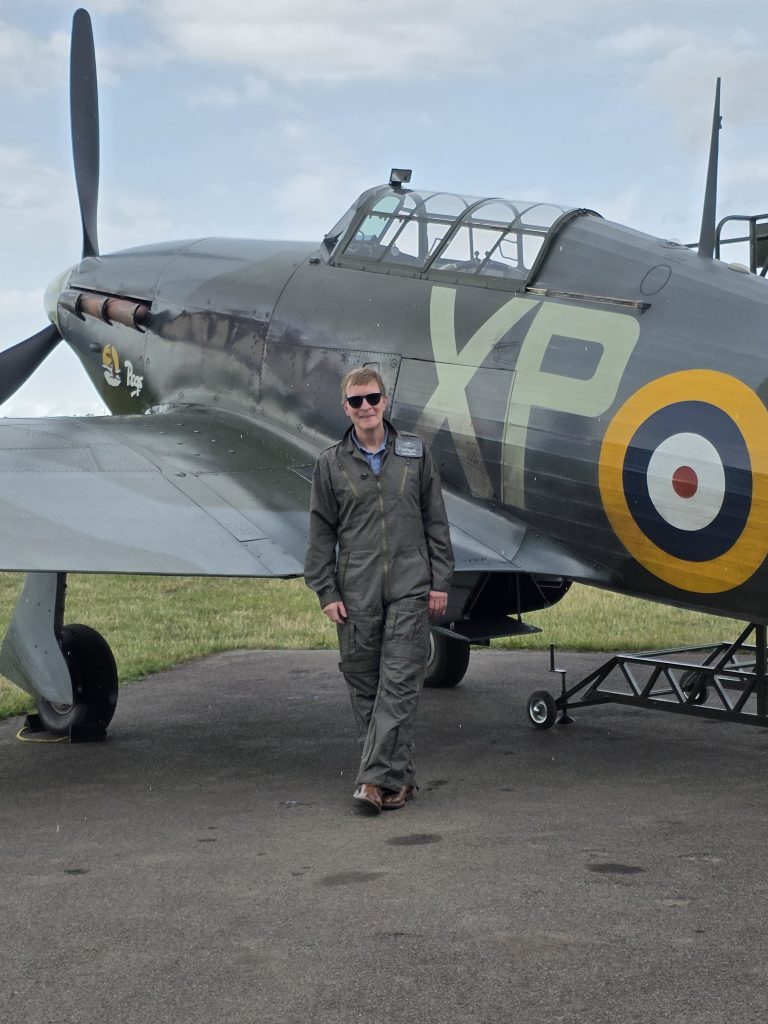 Man next to a Hawker Hurricane